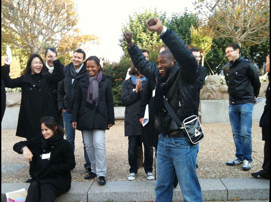 team celebrating victory on the grounds of La Défense